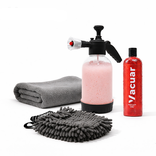 Car care product set with spray bottle, towel, and bottle labeled 'Vacuar' on a white background.